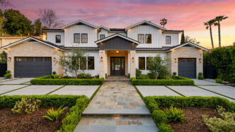 Opulent home with landscape lighting throughout.