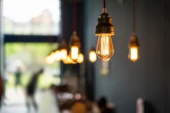 Retro industrial style string light bulb inside building.