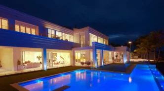 Backyard swimming pool of an extravagant, modern home.