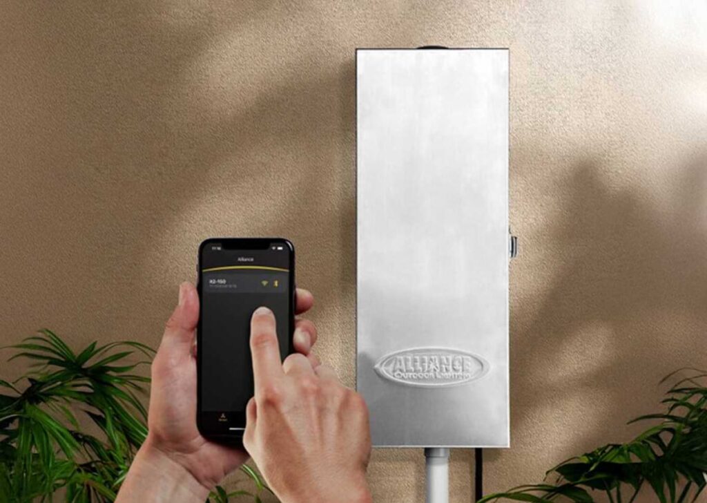 Person using smartphone to program Alliance transformer.